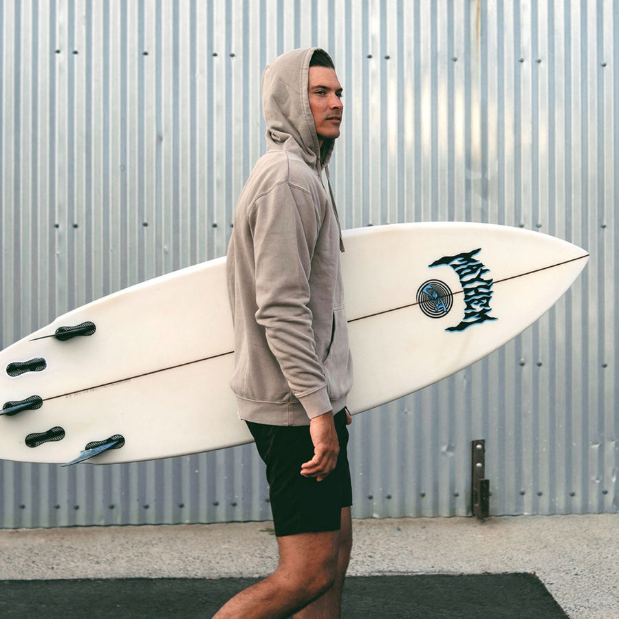 tan hoodie with surfboard