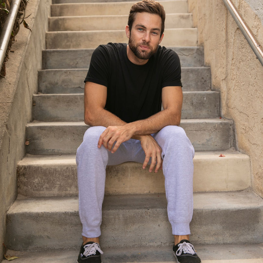 man with joggers on steps