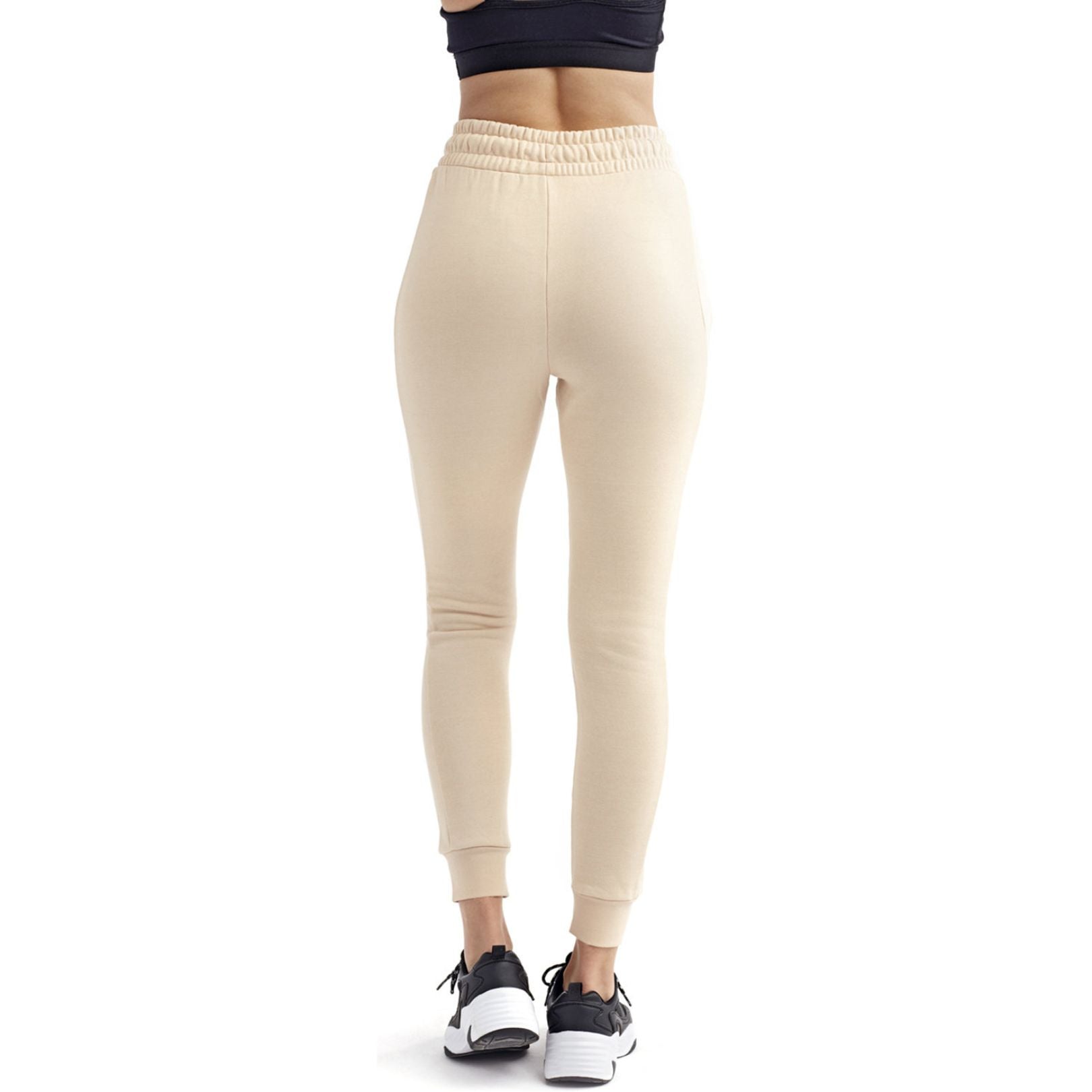 back of tan joggers woman